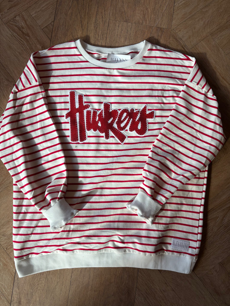 RED METALLIC/WHITE HUSKERS SCRIPT - RED STRIPED CREWNECK