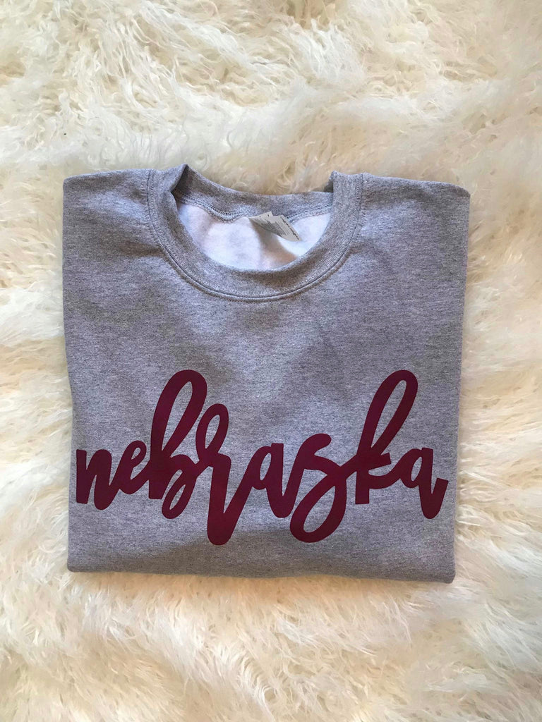 MAROON NEBRASKA ON LIGHT GREY CREW