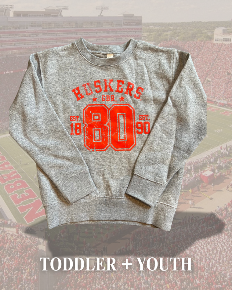 RED HUSKERS 80 TRANSFER DESIGN -  HEATHER GREY CREWNECK (TODDLER + YOUTH)