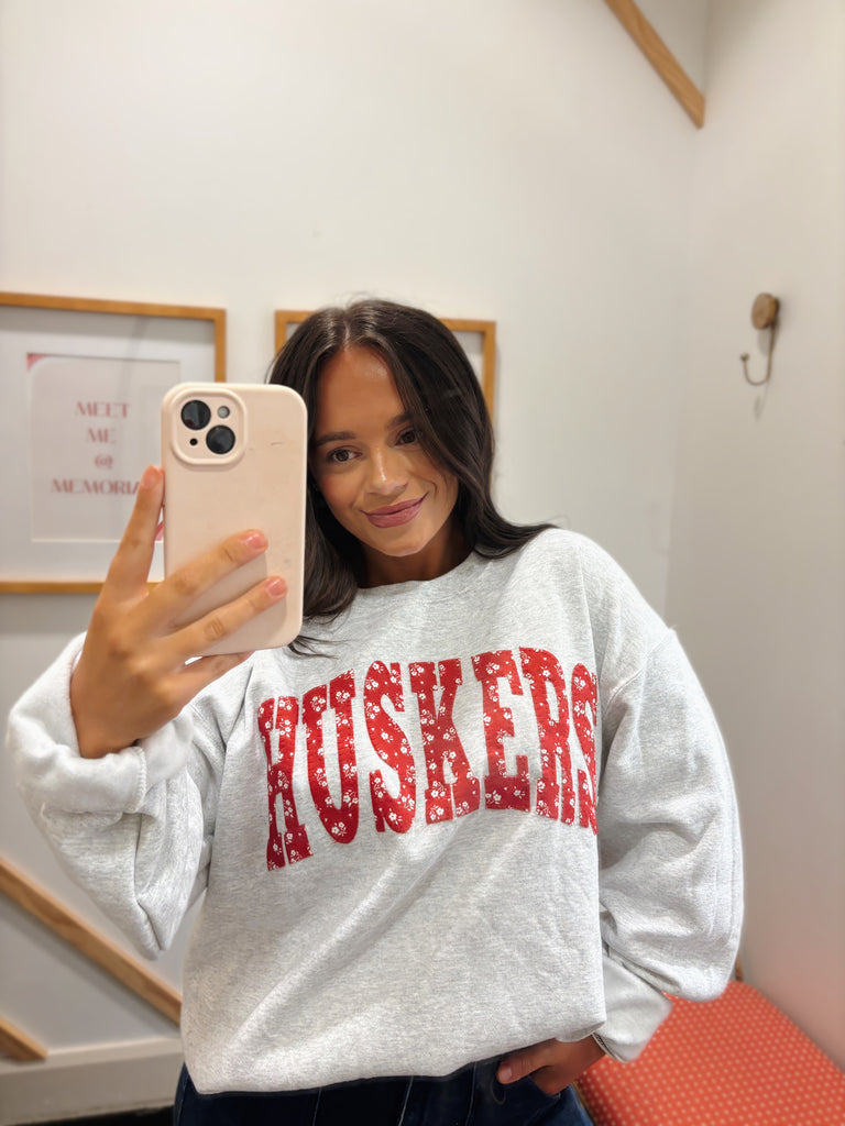 VARSITY RED DAINTY FLORAL HUSKERS - ASH GREY CREWNECK (YOUTH + ADULT)