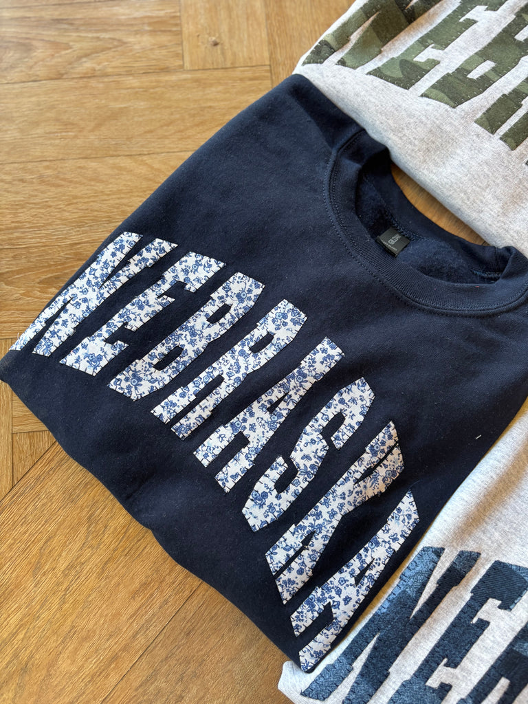 VARSITY BLUE FLORAL NEBRASKA - NAVY CREWNECK