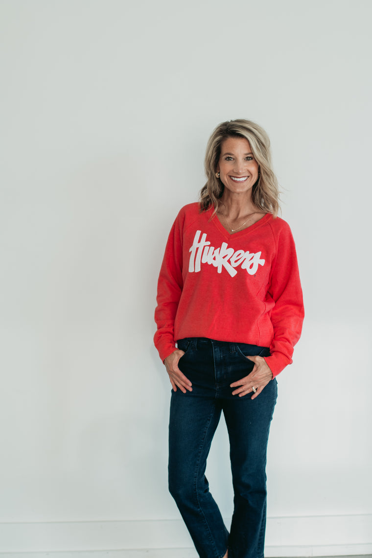 WHITE SPARKLE HUSKERS SCRIPT - RED V-NECK SWEATSHIRT