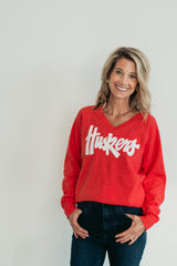 WHITE SPARKLE HUSKERS SCRIPT - RED V-NECK SWEATSHIRT