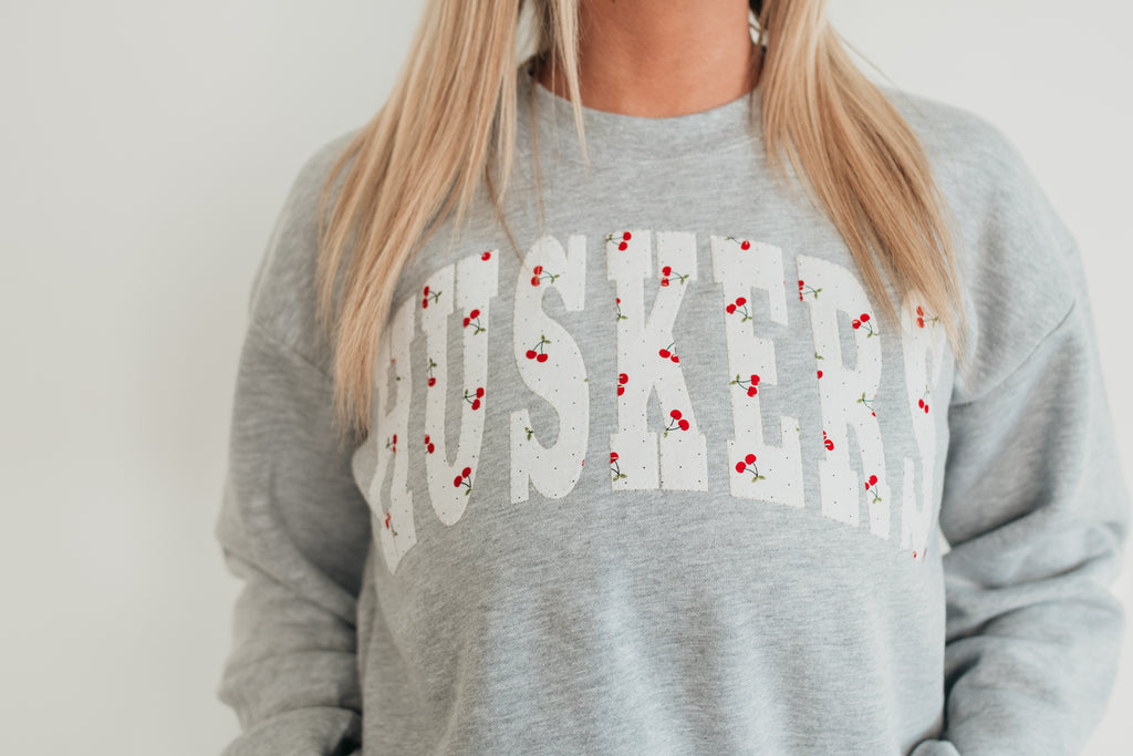 VARSITY CHERRY HUSKERS - GREY CROP CREW