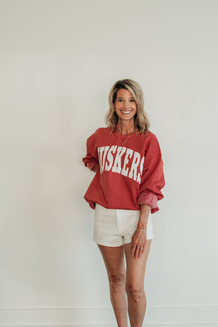 VARSITY WHITE HUSKERS - SCARLET RED CREWNECK