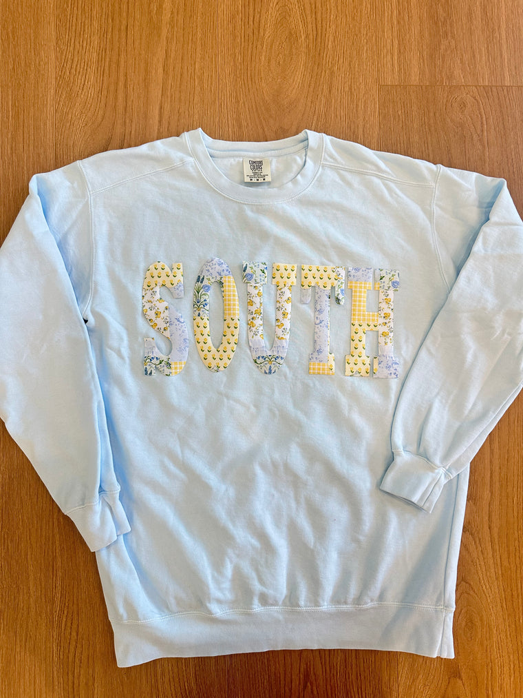 BLUE/YELLOW PATCHWORK SOUTH - LIGHT BLUE COMFORT COLORS CREWNECK