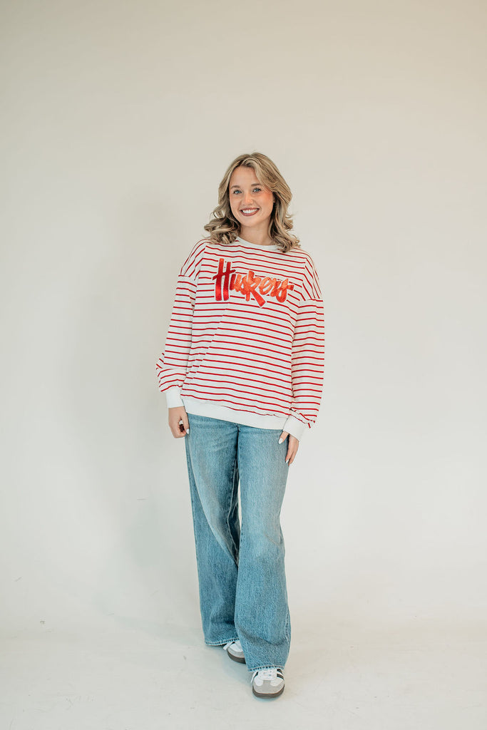 RED METALLIC/WHITE HUSKERS SCRIPT - RED STRIPED CREWNECK