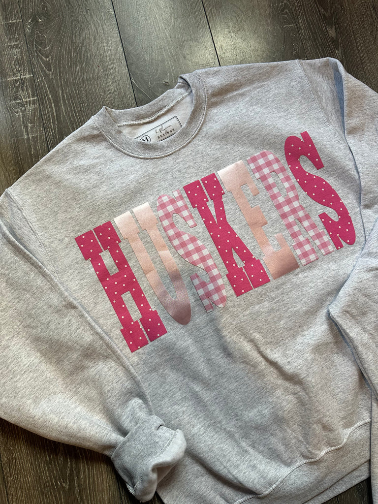 PINK PATCHWORK HUSKERS - ASH CREWNECK