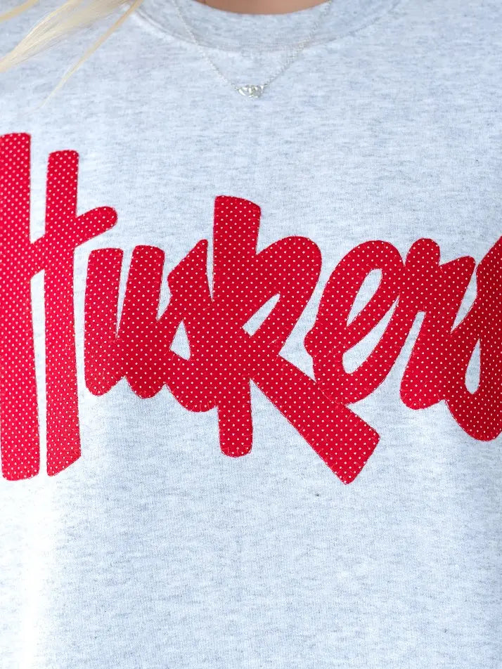 RED POLKA DOT HUSKERS SCRIPT - ASH CREWNECK