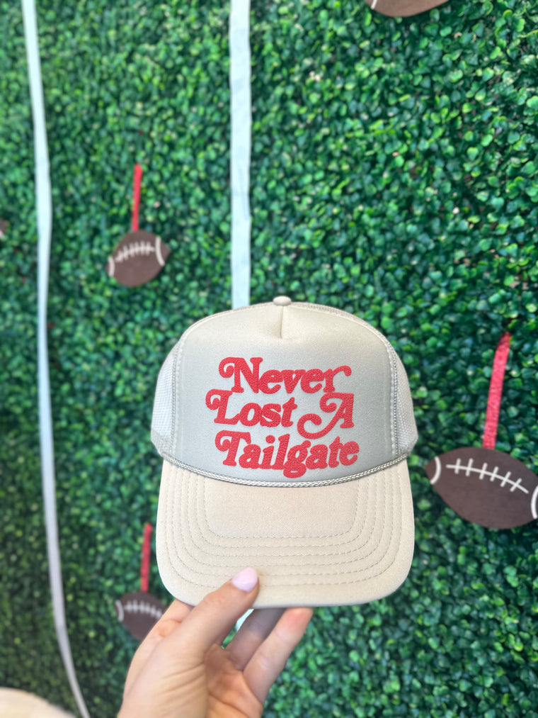 NEVER LOST A TAILGATE TAN TRUCKER HAT **