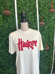 RED HUSKERS SCRIPT - IVORY TEE **
