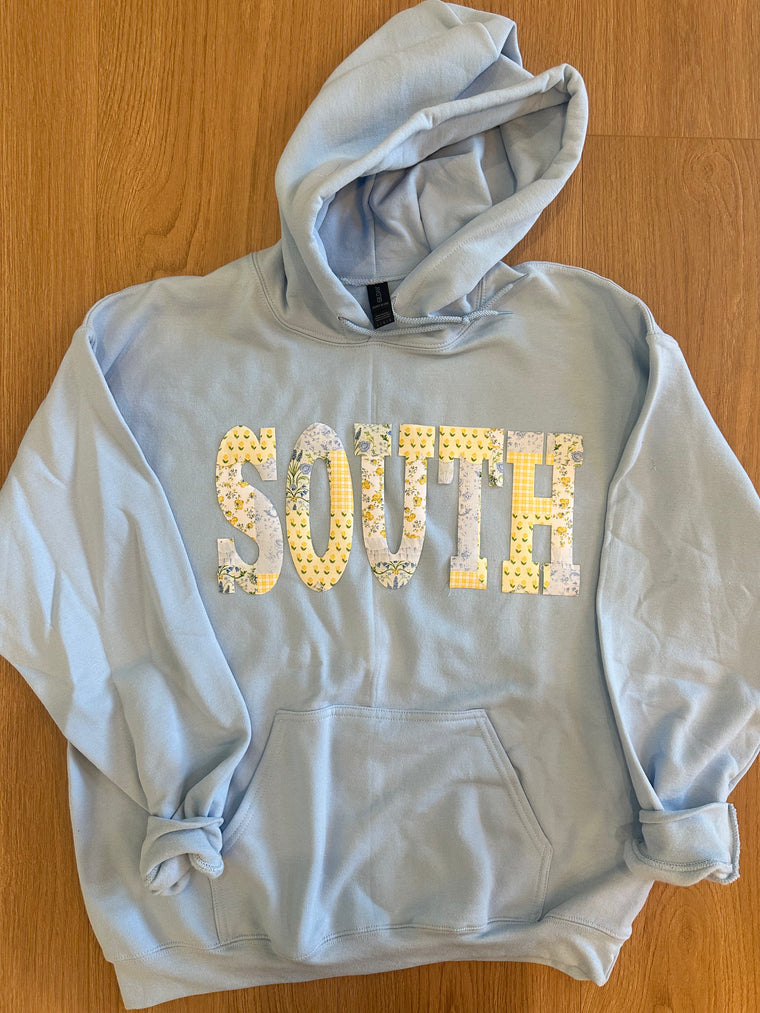 YELLOW + BLUE PATCHWORK SOUTH  - LIGHT BLUE HOODIE