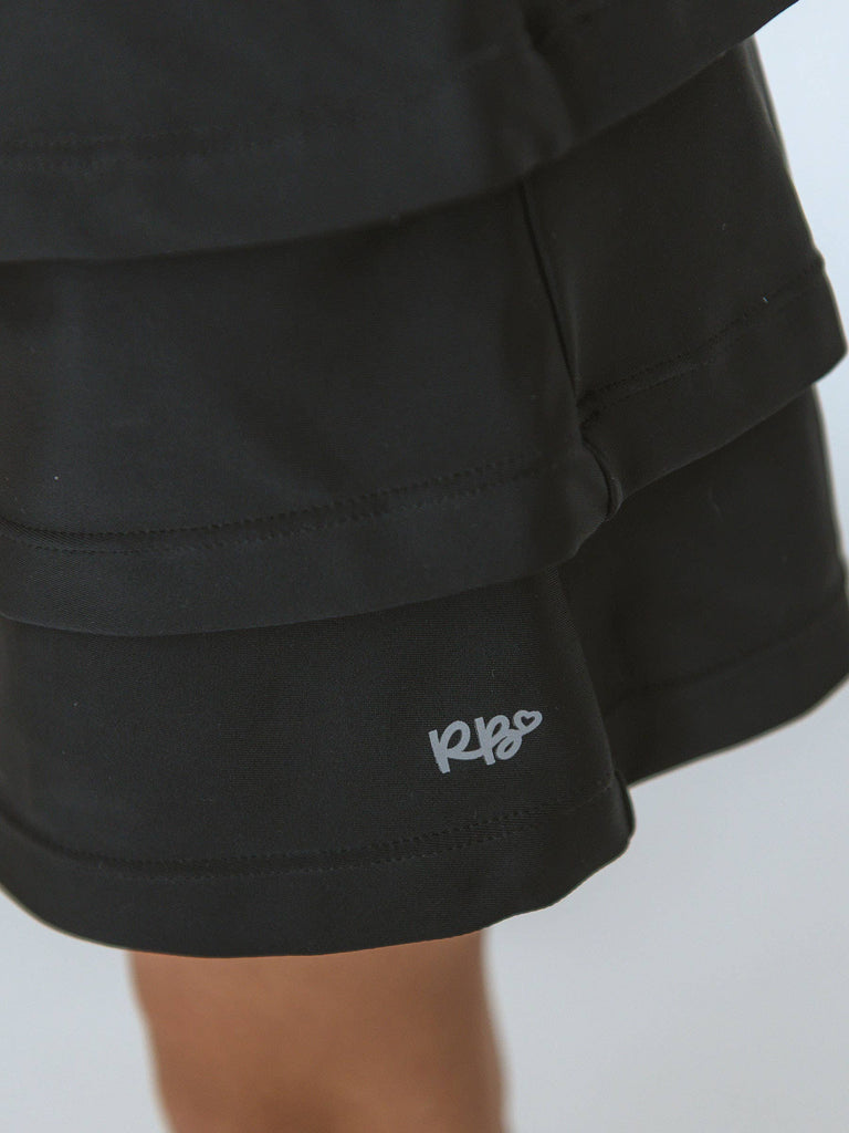 RuffleButts + RuggedButts - Girls Black Tiered Active Skort: Black / 5