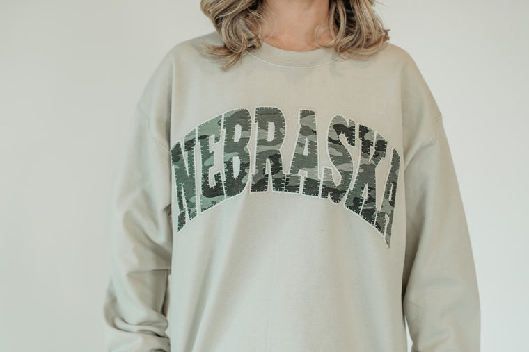 NEBRASKA (camo + white backing) - SAND CREWNECK