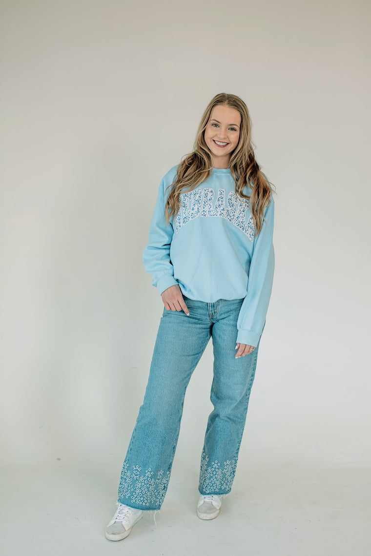 NEBRASKA (BLUE FLORAL + WHITE BACKING) - LIGHT BLUE CREWNECK