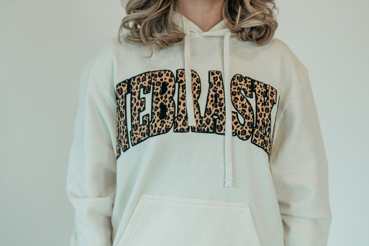 NEBRASKA (cheetah/black backing) - IVORY HOODIE