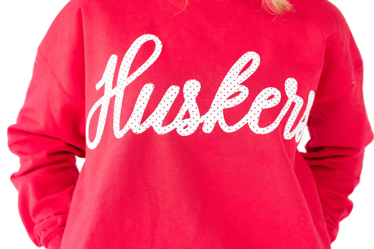 SIGNATURE RED/IVORY POLKA DOT HUSKERS - RED CREWNECK